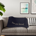You Are Loved navy sherpa blanket with gold affirmation script