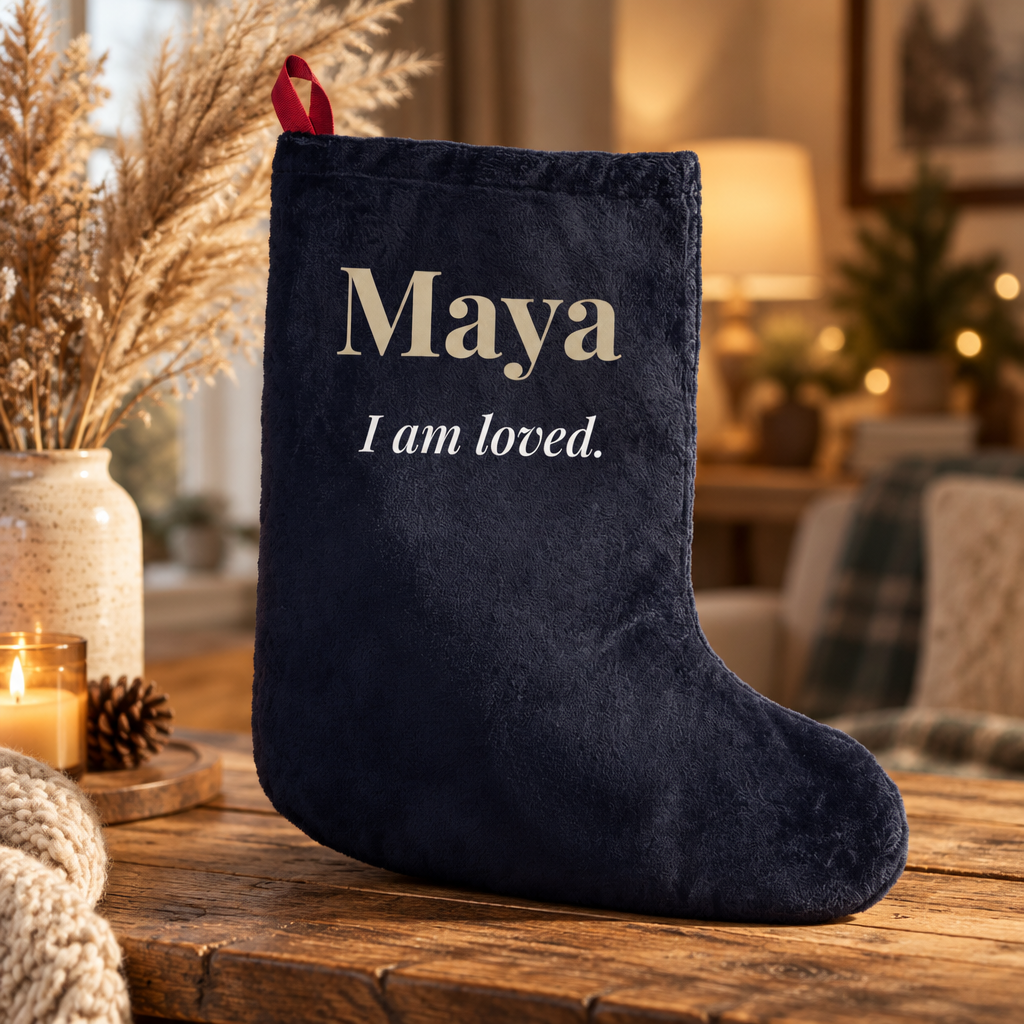 Personalized navy Christmas stocking with child's name in gold and "I am loved." affirmation