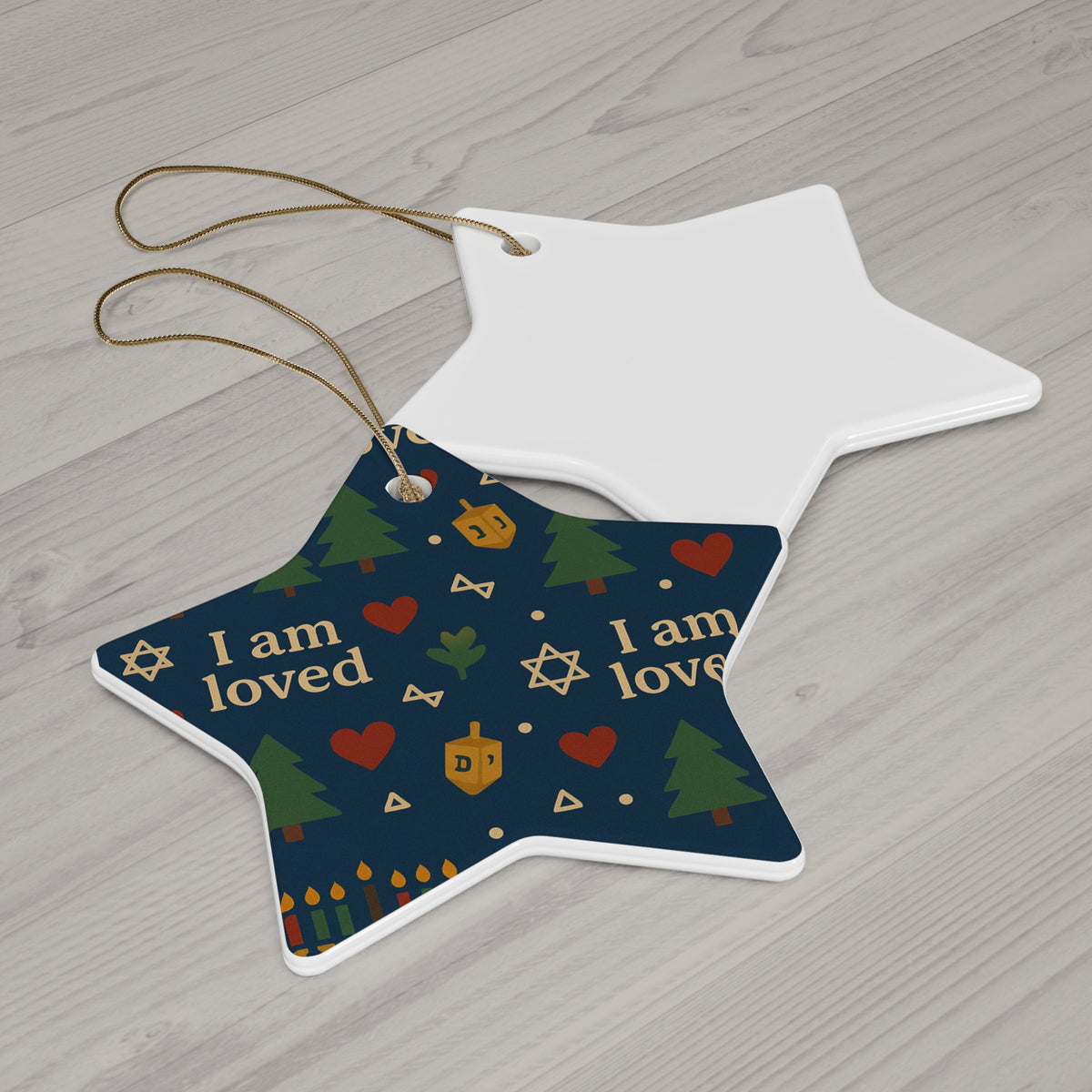 I Am Loved ceramic affirmation ornament hanging on a Christmas tree